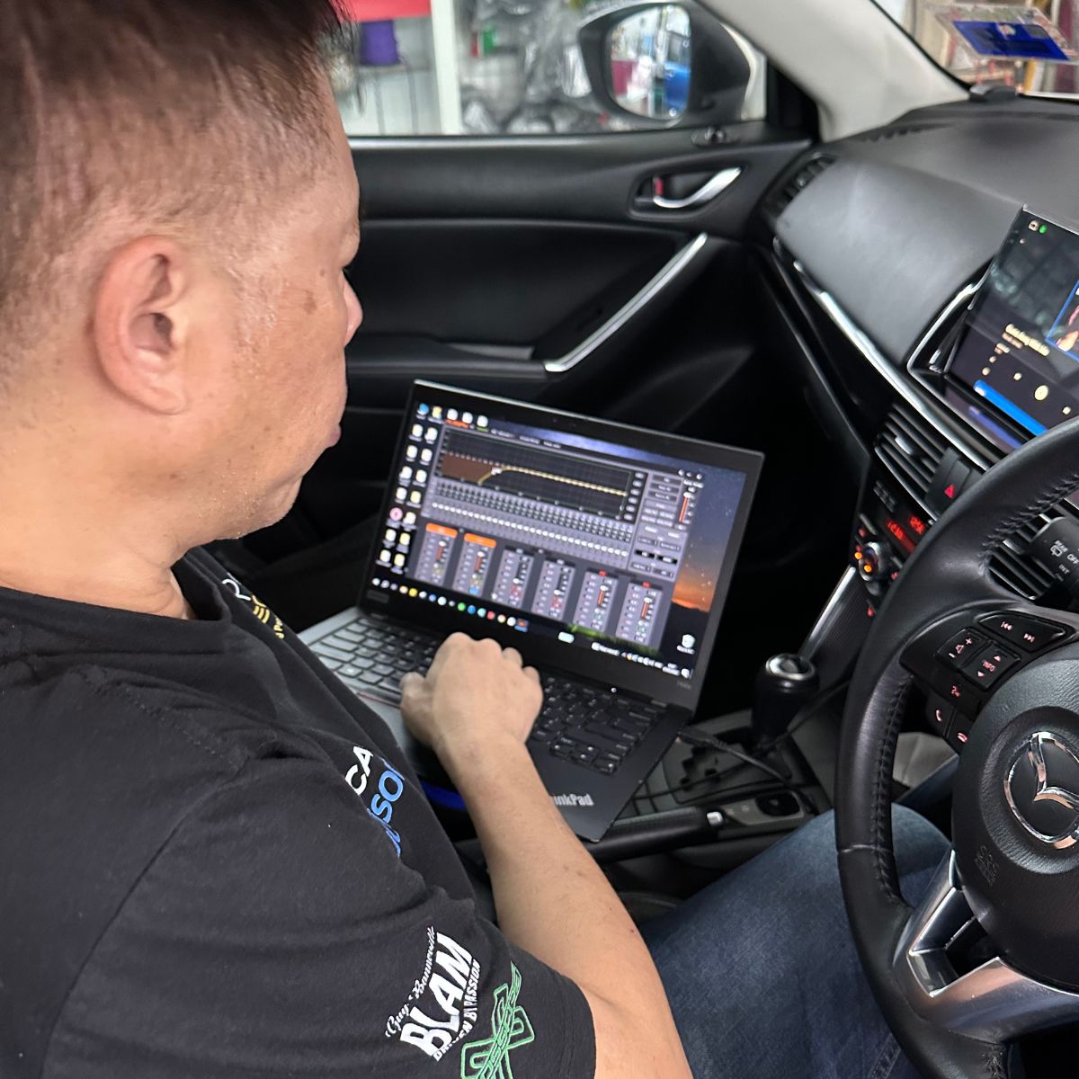 DSP tuning laptop software connected for audio calibration